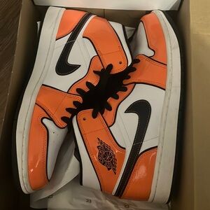 Orange black and white air jordan 1 mid se